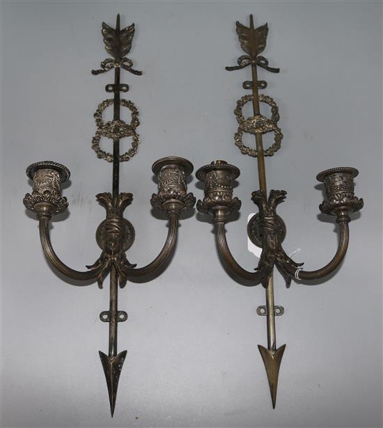 A pair of silvered wall lights,